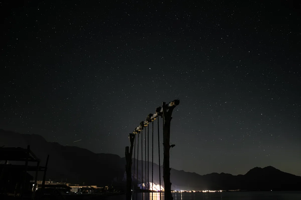 Camp swing with star trails above