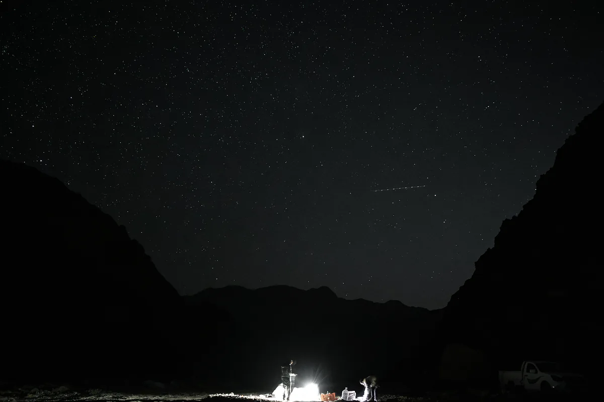 Camp setup deep in a mountain canyon at night