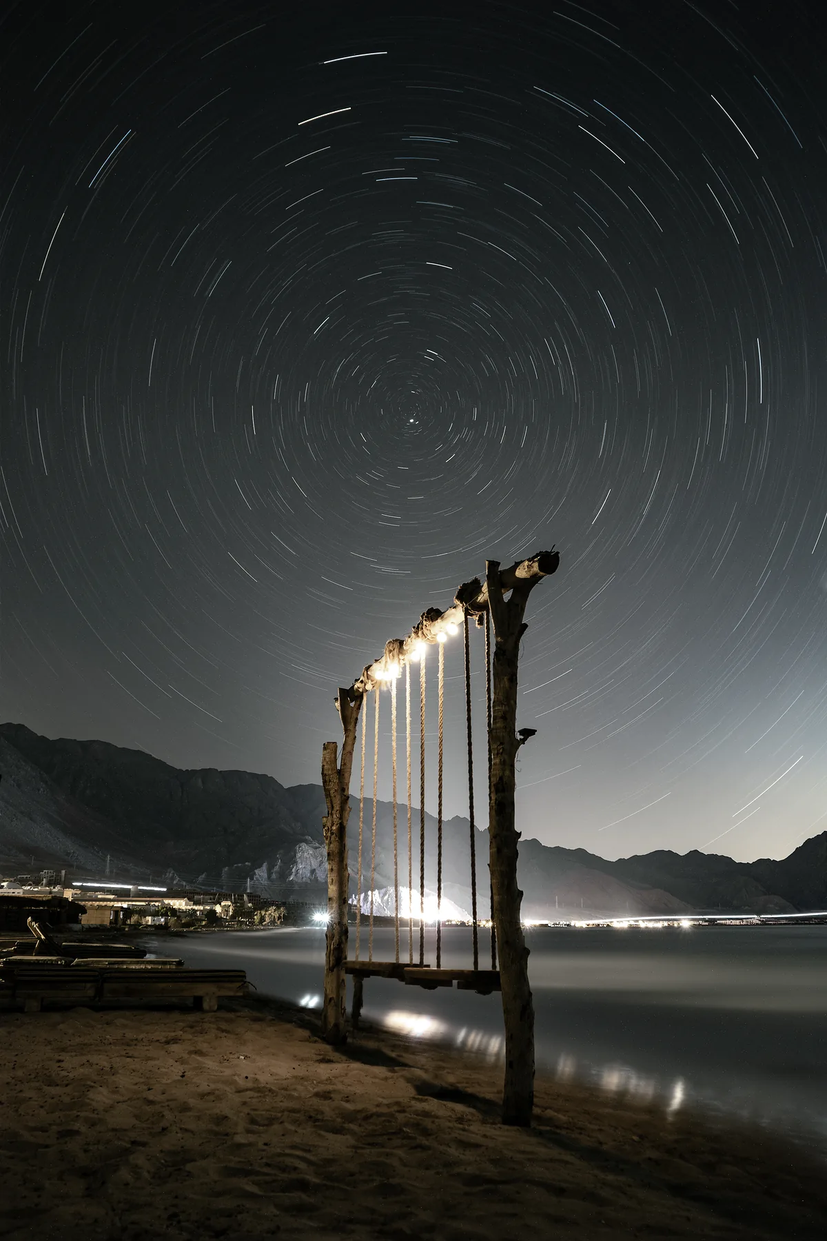 Circular star trails around Polaris above the camp swing